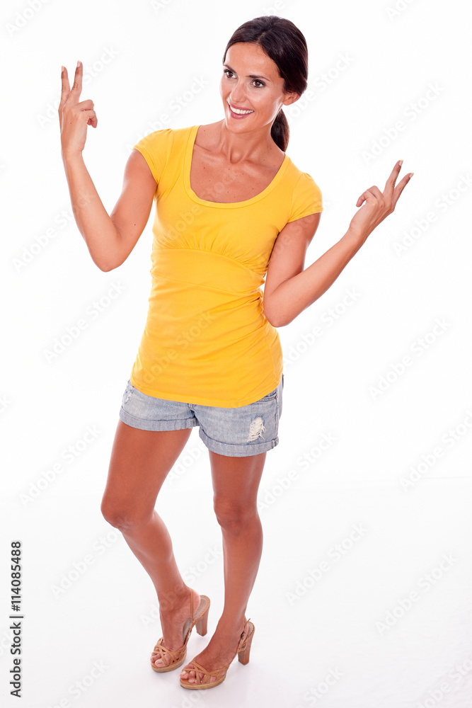 Celebrating brunette woman posing on white Celebrating brunette woman posing on white