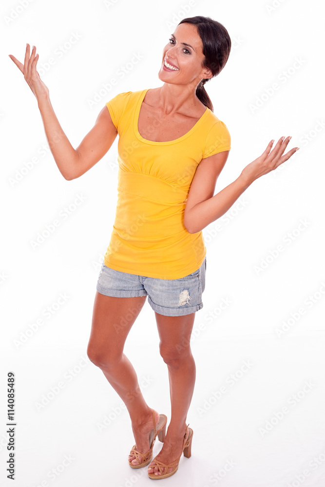 Celebrating brunette woman posing on white Celebrating brunette woman posing on white