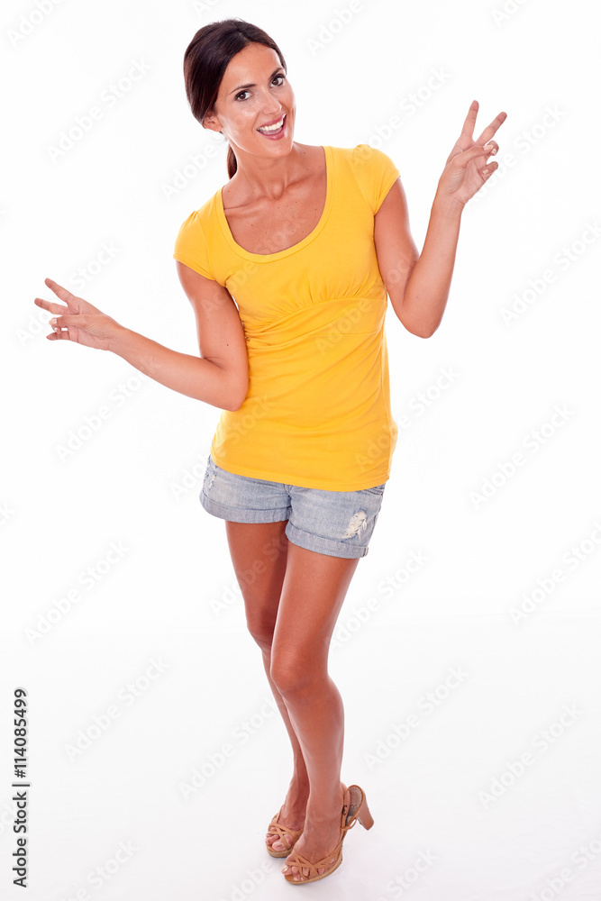 Happy smiling brunette gesturing peace sign Happy smiling brunette gesturing peace sign