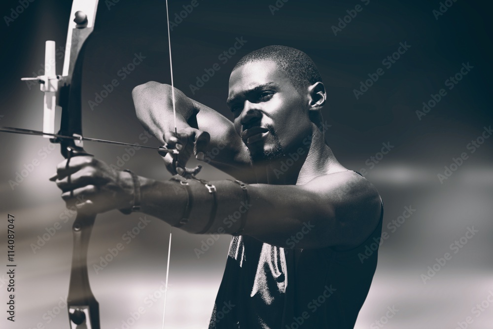 Composite image of facing view of man practicing archery Composite image of facing view of man practicing archery