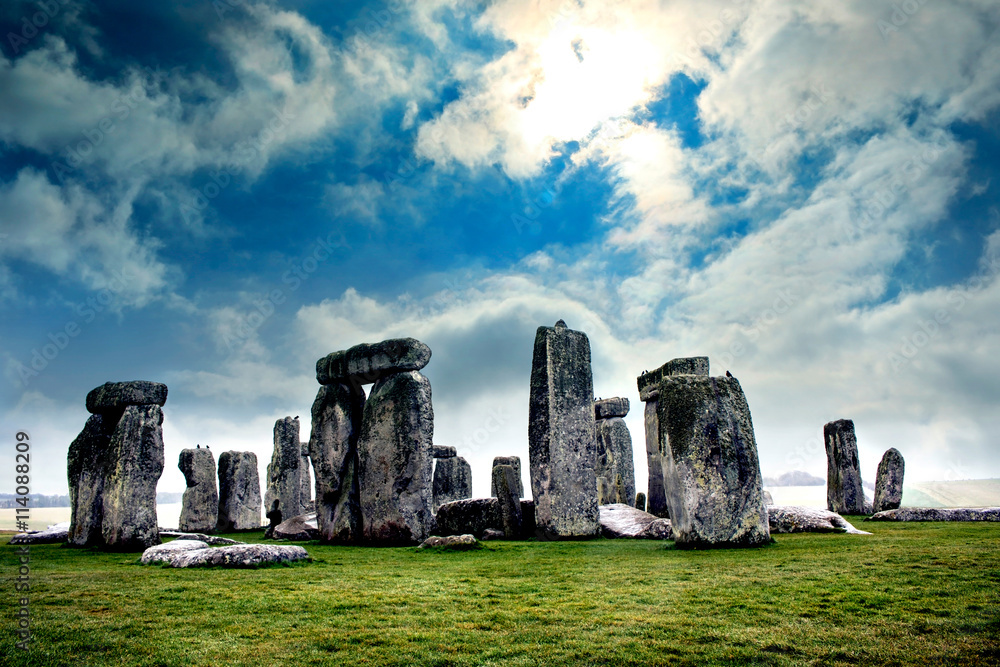 Blue sky over Stonehenge England. Massive standing megalith stones. 