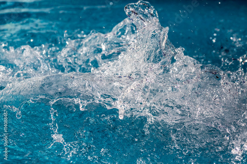 Wallpaper Mural Splash of water in swimming pool with blue floor. Background image Torontodigital.ca