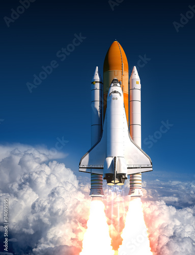 Fototapeta Naklejka Na Ścianę i Meble -  Space Shuttle Launch In The Clouds