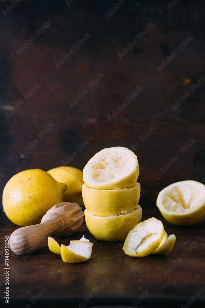 Fresh lemons and juicer. selective focus Fresh lemons and juicer. selective focus