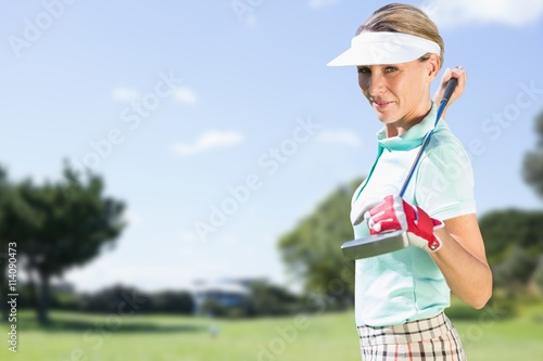 Woman golf player looking the camera
