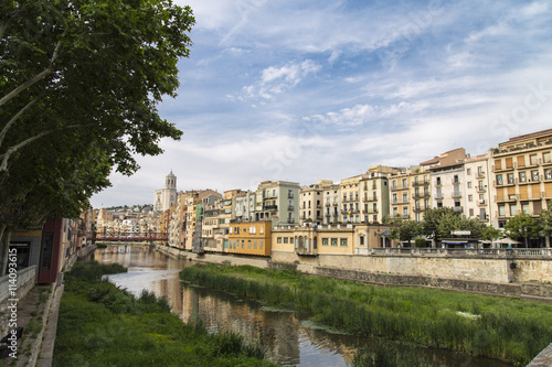 Skyline of the beautiful city and the river in Girona, Catalonia. Old cathedral with old river houses and river reflection