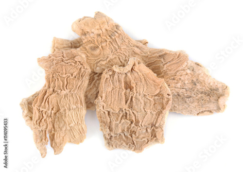 Dried ginger slices isolated on white