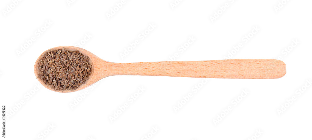 Cumin seeds in spoon on white background Cumin seeds in spoon on white background