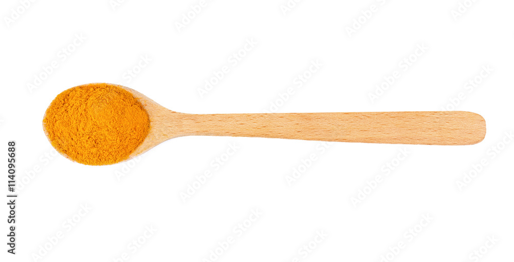 Powdered turmeric in spoon on white background Powdered turmeric in spoon on white background