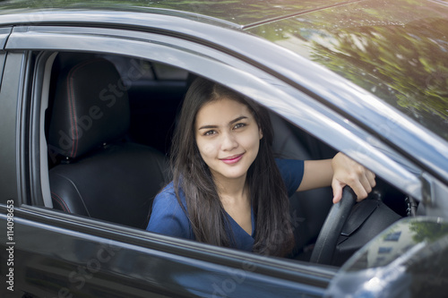 Attractive business woman driving her car