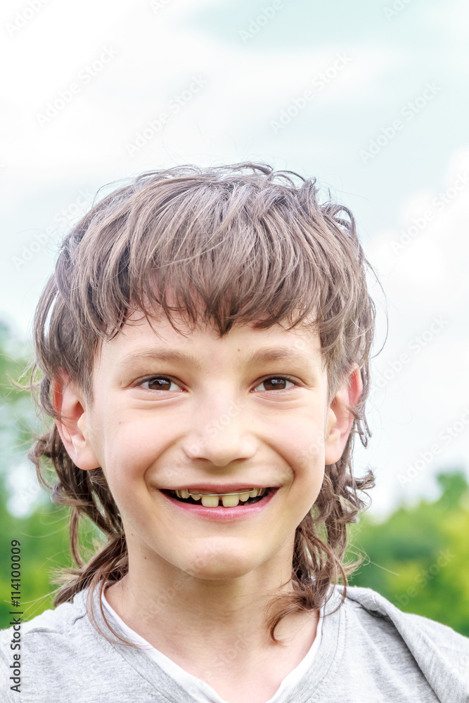 Adorable young child boy in the park. On warm summer day during Adorable young child boy in the park. On warm summer day during