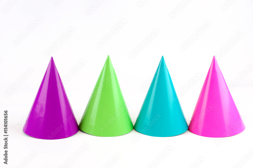 shiny party hats on white background shiny party hats on white background
