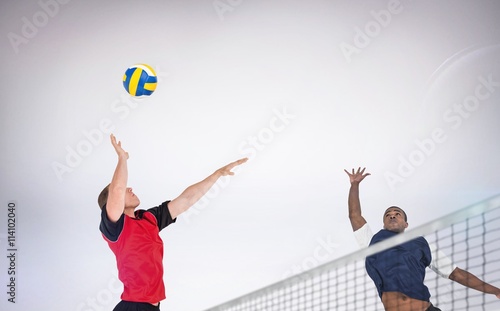 Photography Composite image of sportsman posing while playing volleyball