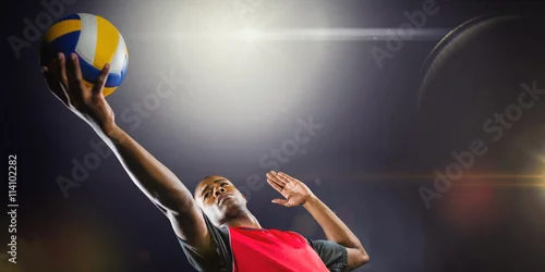 Obraz Złożony wizerunek bawić się siatkówkę sportowiec