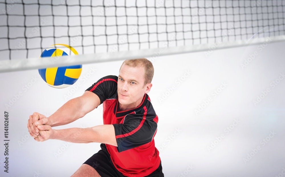 Composite image of sportsman posing while playing volleyball
