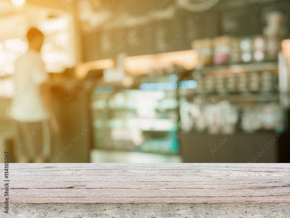 wooden top with Coffee shop blur background