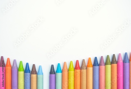Crayons lined up in a V shape with one missing