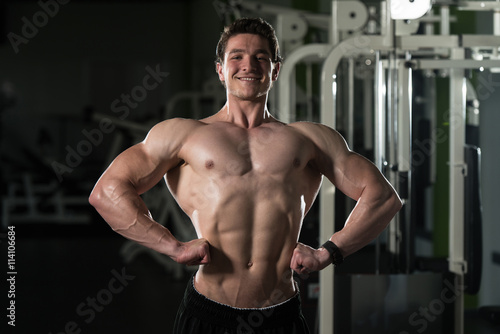 Athletic Bodybuilder Fitness Model Posing Exercises