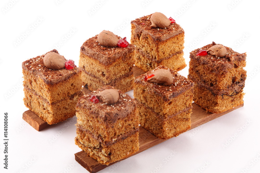 Tasty chocolate cream layer cakes in white background,. Tasty chocolate cream layer cakes in white background,.