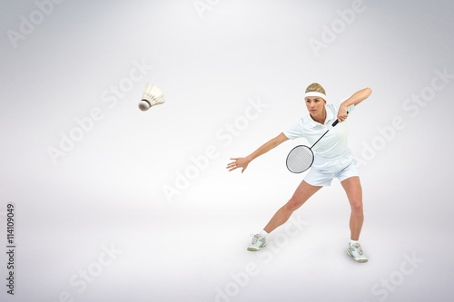 Composite image of badminton player playing badminton © vectorfusionart