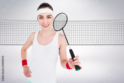 Composite image of badminton player is posing and smiling © vectorfusionart