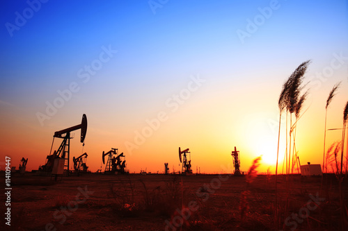 In the evening  the silhouette of the oil pump