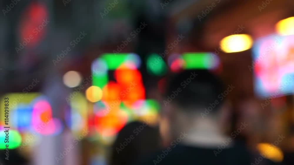 Blur people walking in city night background of Hong Kong illuminated light signs Blur people walking in city night background of Hong Kong illuminated light signs