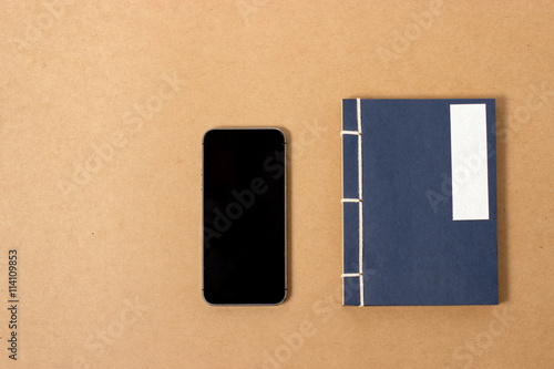 vintage notebook and smartphone