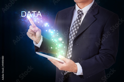 Businessman holding tablet with pressing data. internet and networking concept