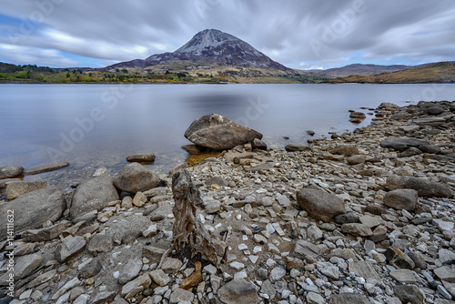 Mount Errigal, Co. Donegal, Ireland, reflected in blue lake surrounded by peatland in national park, nature