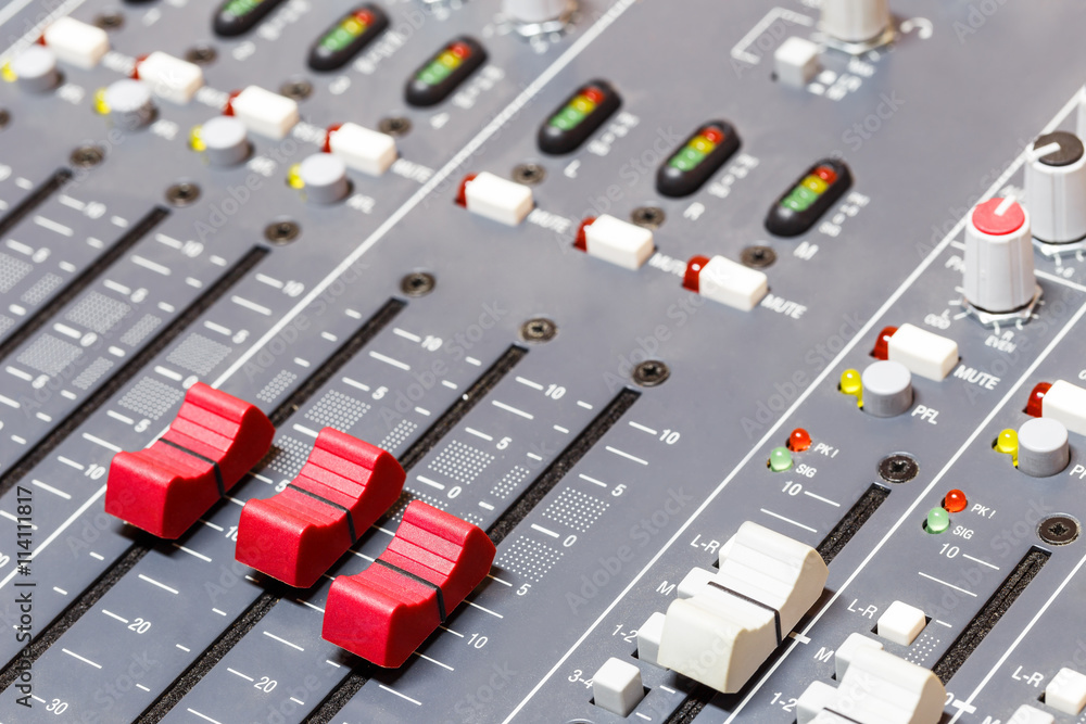 Closeup on sliders of sound mixing console in audio recording Closeup on sliders of sound mixing console in audio recording