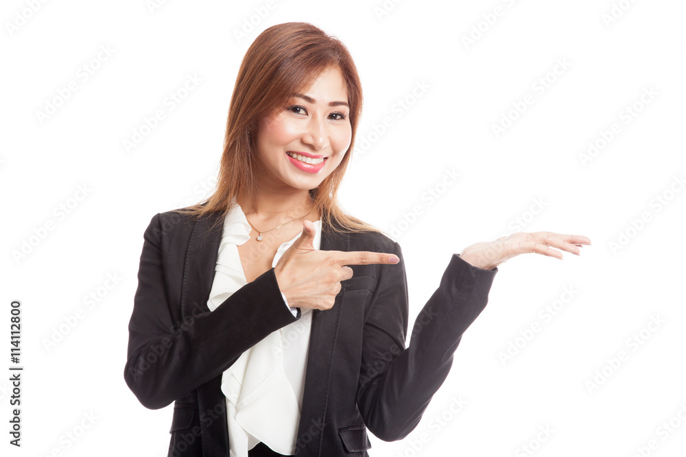 Beautiful young Asian woman point to palm hand Beautiful young Asian woman point to palm hand