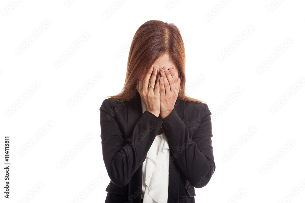 Sad young Asian businesswoman cry with palm to face Sad young Asian businesswoman cry with palm to face