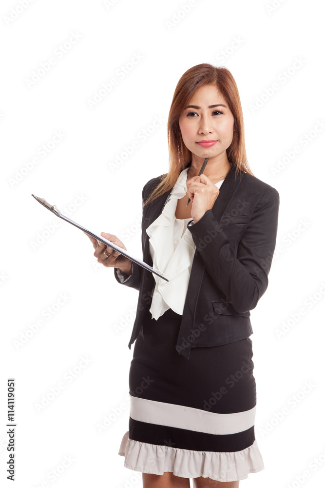 Young Asian business woman thinking with pen and clipboard Young Asian business woman thinking with pen and clipboard