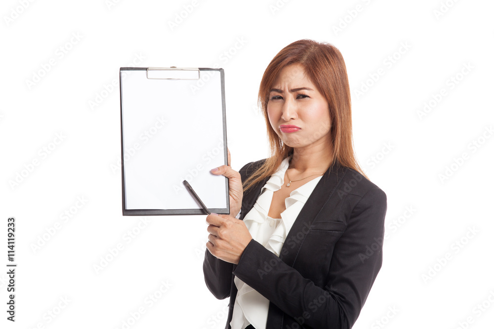 Unhappy Asian business woman point to clipboard with pen Unhappy Asian business woman point to clipboard with pen