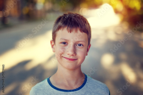 Happy little boy in sunset vintage photo