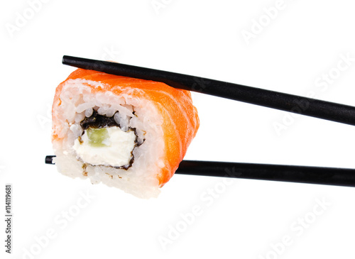 sushi roll in chopsticks Isolated on white