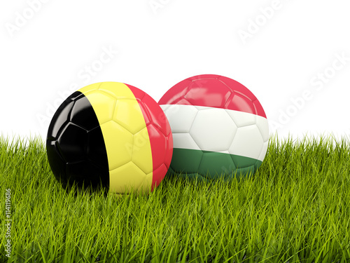 Hungary and Belgium soccer balls on grass
