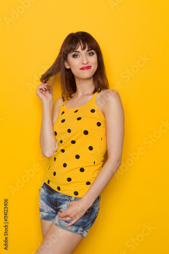 Happy Girl Agains Yellow Background