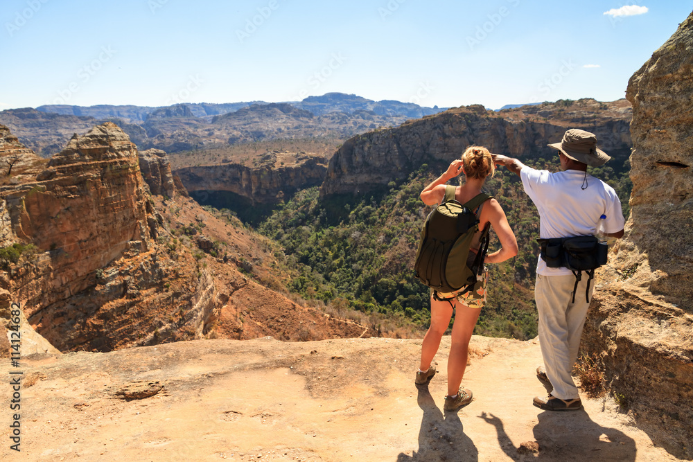 Tourist looking out over the beautiful landscape of Isalo national park in Madagascar