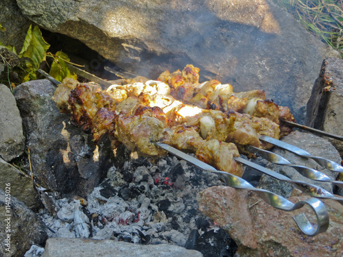 Preparing meat shish kebab (shashlik) on skewers