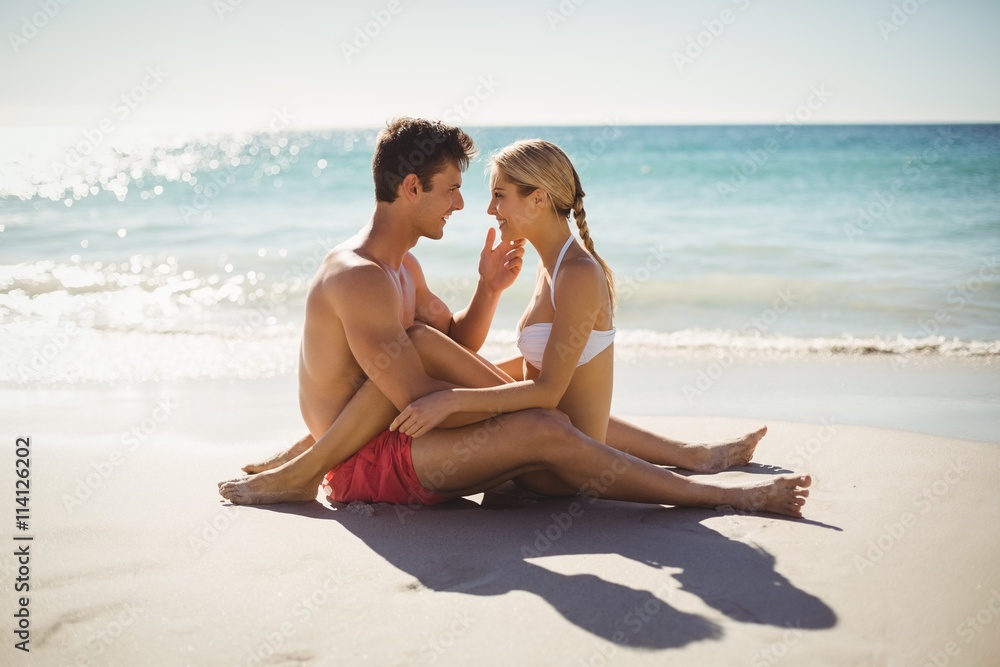 Fototapeta premium Couple having fun on beach