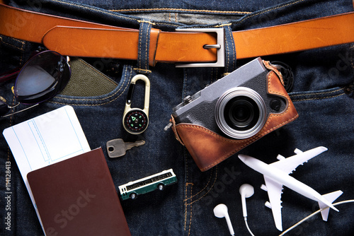 Travel gear and tablet on Jeans background. Travel concept