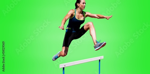 Athletic woman doing show jumping