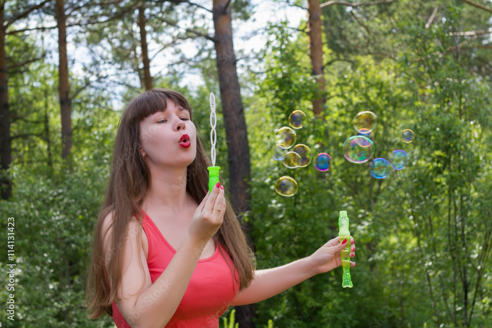 white woman make bubble blower outdoors white woman make bubble blower outdoors