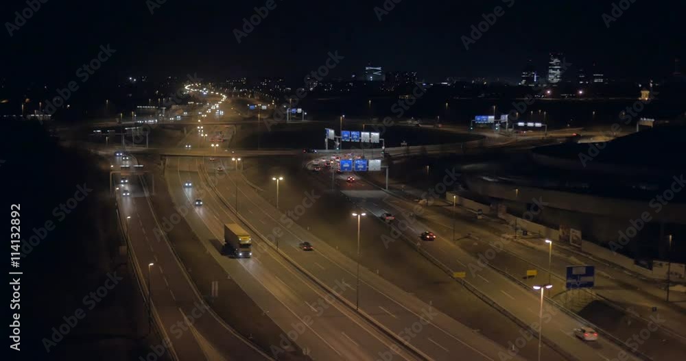 Total aerial view over O ring intersection with cityscape at night
Total aerial view over O ring intersection with cityscape at night