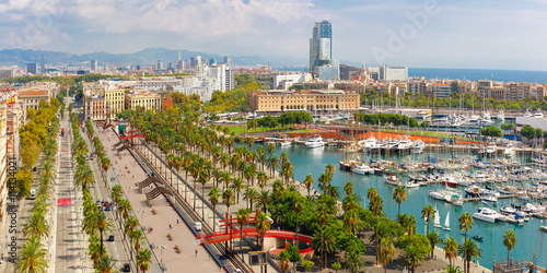 Aerial panoramic view over Passeig de Colom or Columbus avenue, La Barceloneta and Port Vell marina from Christopher Columbus monument in Barcelona, Catalonia, Spain photo