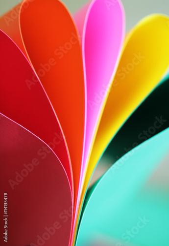 Abstract paper stack defocused colourful background. Paper stack of different colors defocused