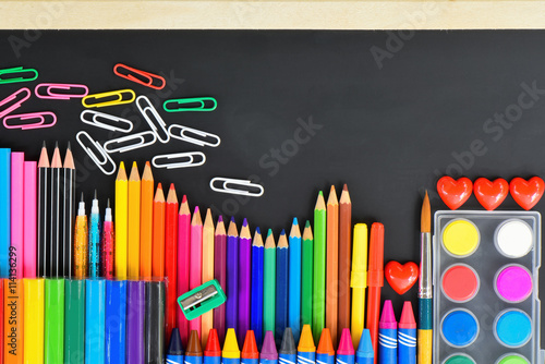 Various School supply on blackboard  Colourful office supply