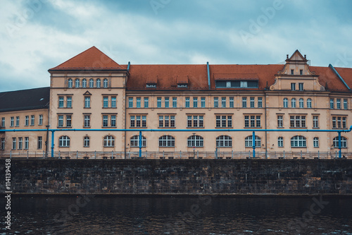 European building with canal in foreground